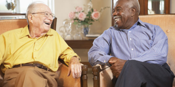 Two men laughing together